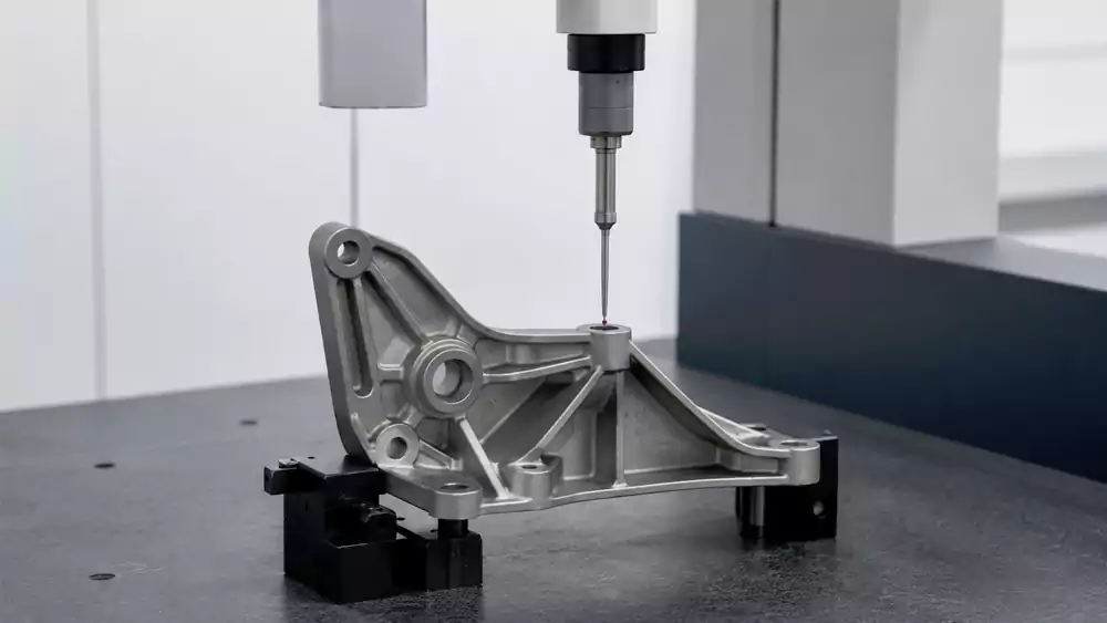 engine mount bracket undergoing dimensional inspection with precision measuring equipment