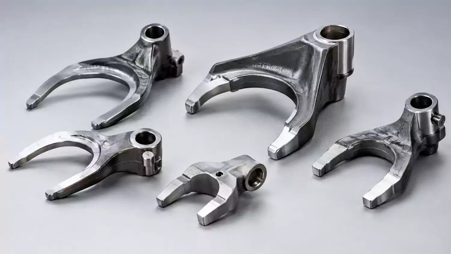 Custom shift forks for automotive transmissions